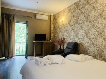 Фото номера Большой двухместный номер с 1 кроватью Отель Wald Hotel Lagodekhi Rooms г. Лагодехи 4
